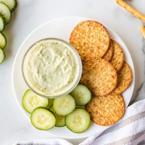 Creamy Avocado Ranch Dip with Crackers and Cucumbers