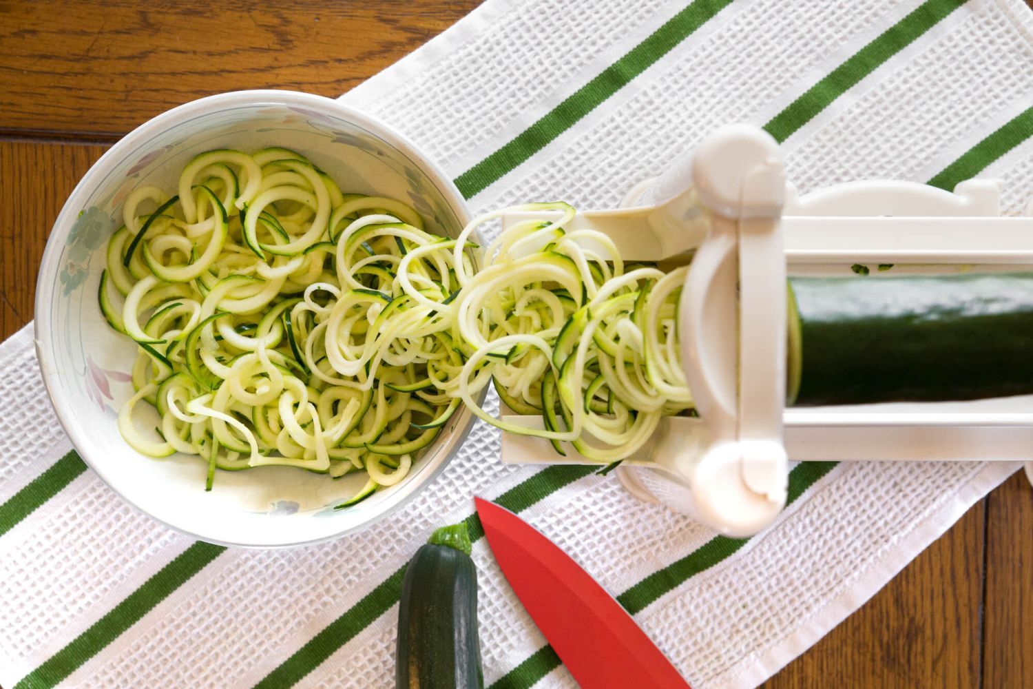 Plate of zucchini noodles being made with a spiralizer.