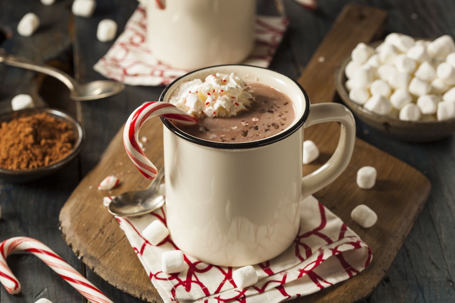 Healthy Peppermint Mocha in a mug with a candy cane and whipped cream.