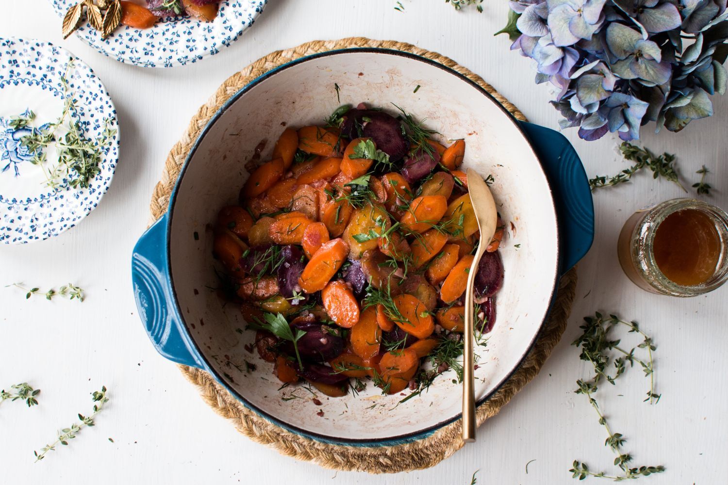 Sauteed carrots made with butter, garlic, balsamic vinegar, and fresh herbs in a bowl. 