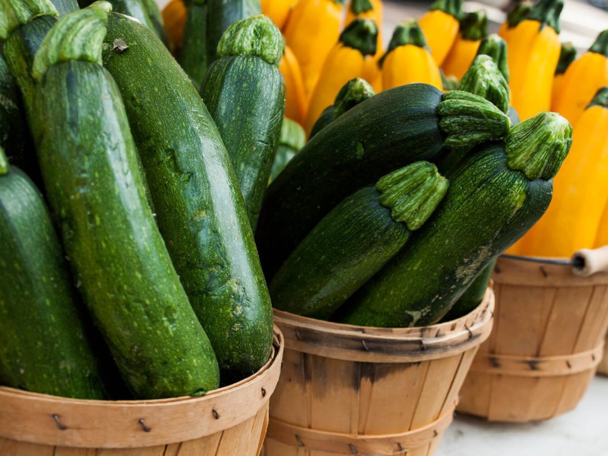Fresh zucchinis in baskets