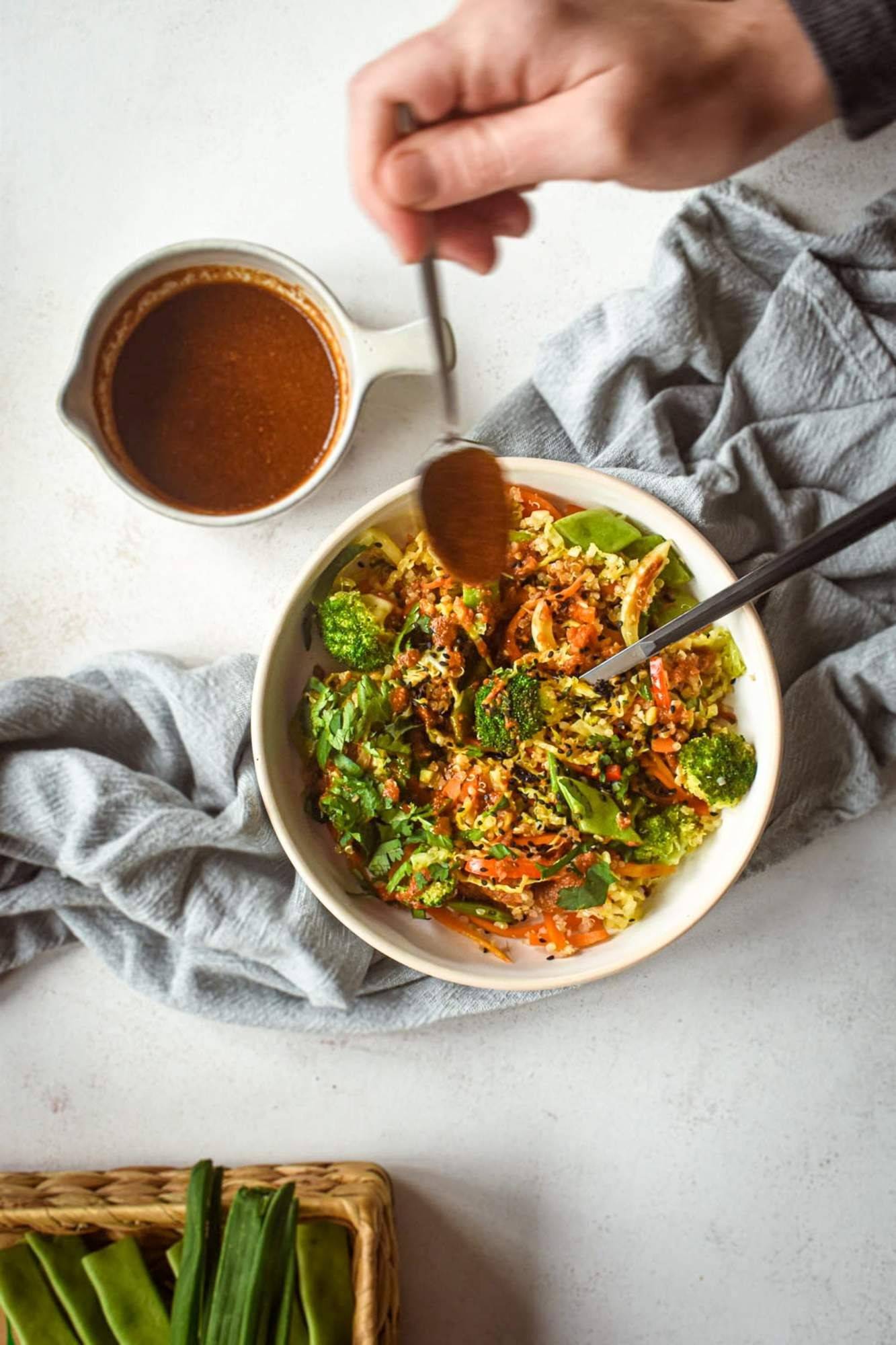 Stir the chili peppers in a bowl with quinoa and vegetables and drizzle the spicy stir-fry sauce with a spoon on top.
