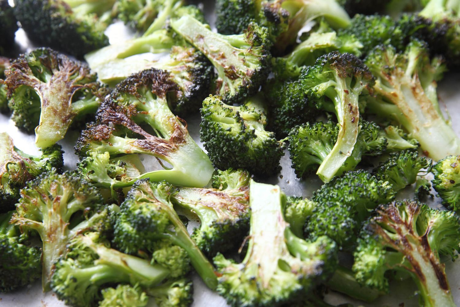 Place the broccoli on the pan and roast until crispy on the edges.
