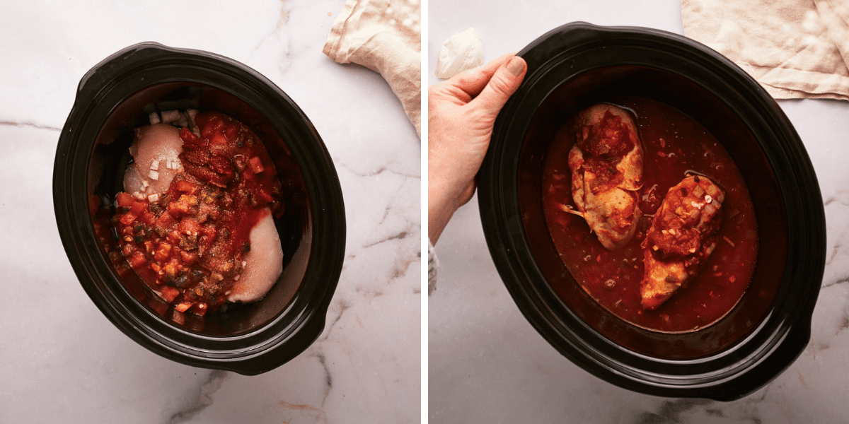 A slow cooker filled with raw chicken breasts, diced tomatoes and spices, ready to cook.