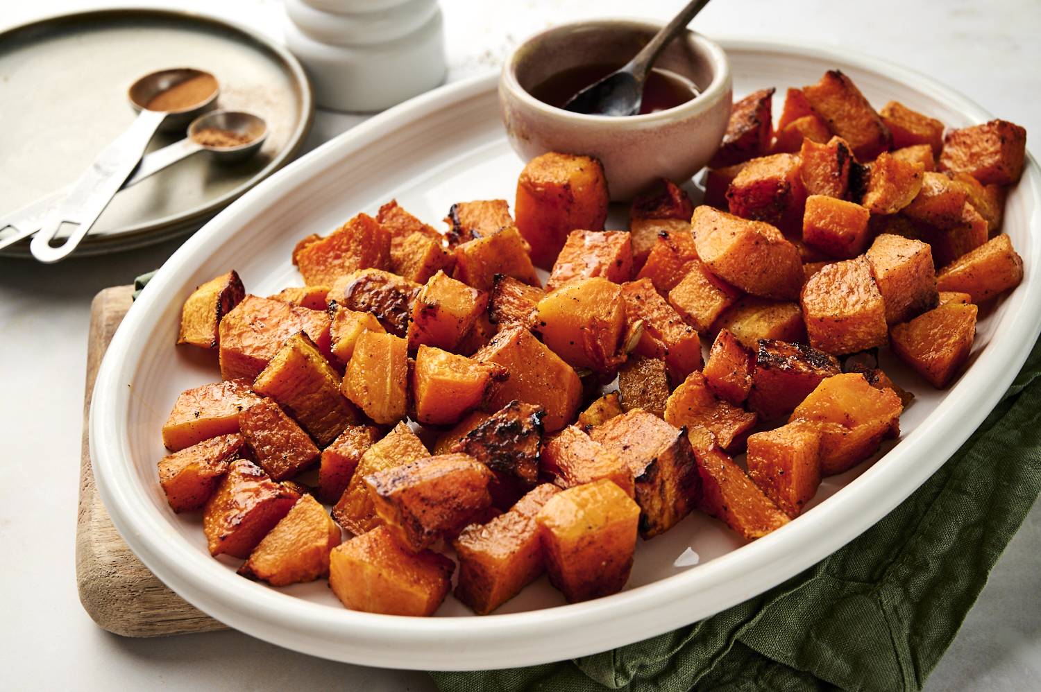 Baked butternut squash sitting in plate ready to be served.