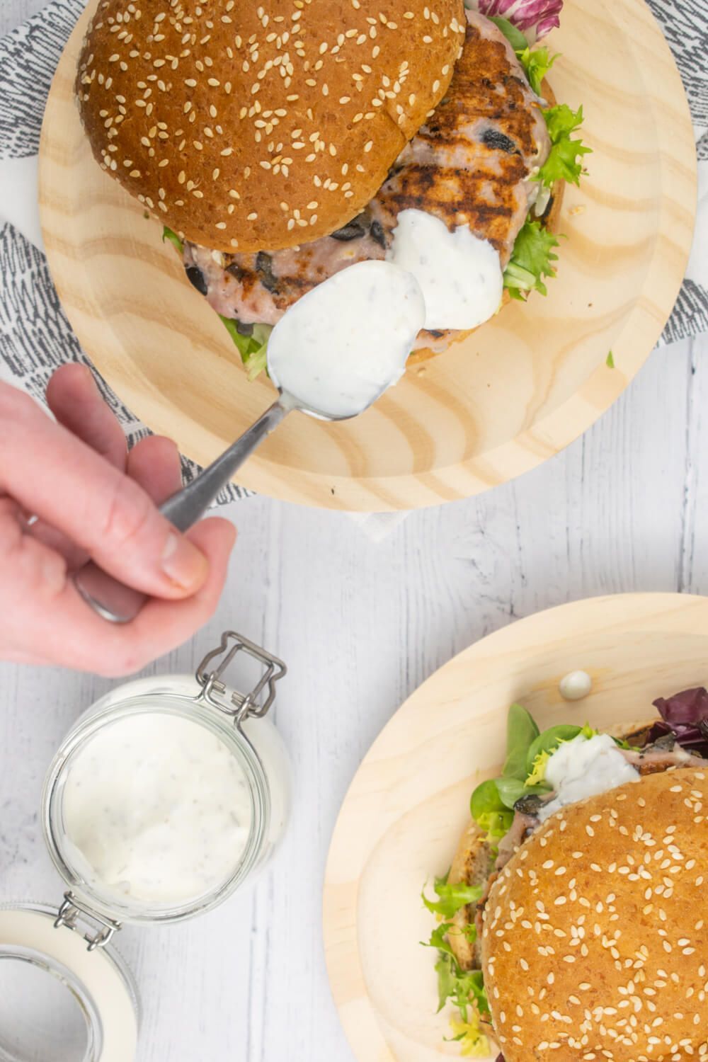 Greek Turkish burger and olives on sesame burger bread.
