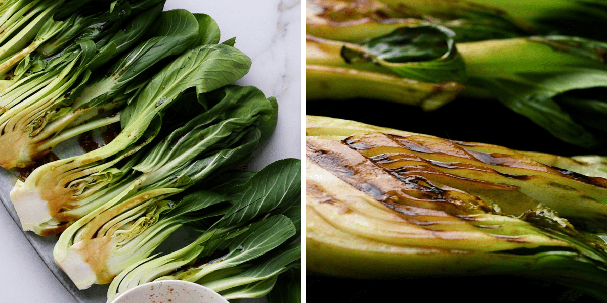 The grilled Bok Choy is arranged on the plate, showing vibrant green leaves and burnt grill traces, accompanied by a small bowl of sauce.