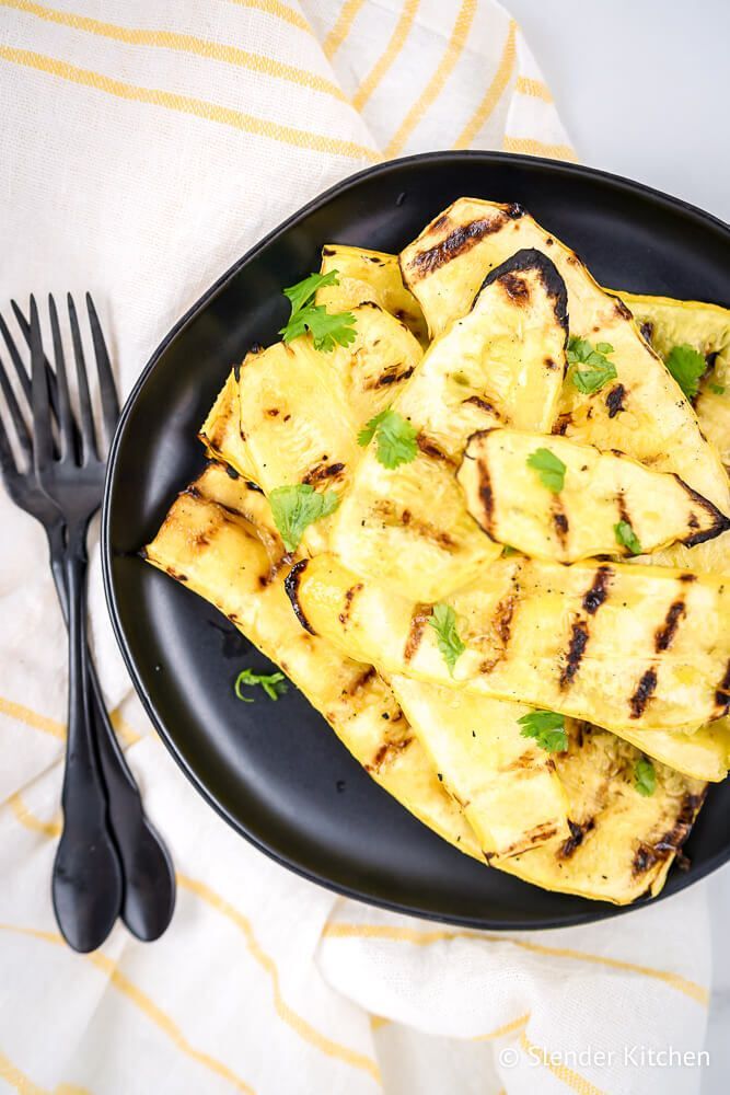 Roasted summer pumpkin cut into wooden boards and sprinkle with salt, pepper and parsley.
