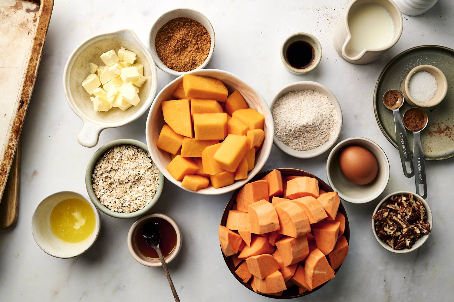 Ingredients for sweet potato casserole laid out on a counter.
