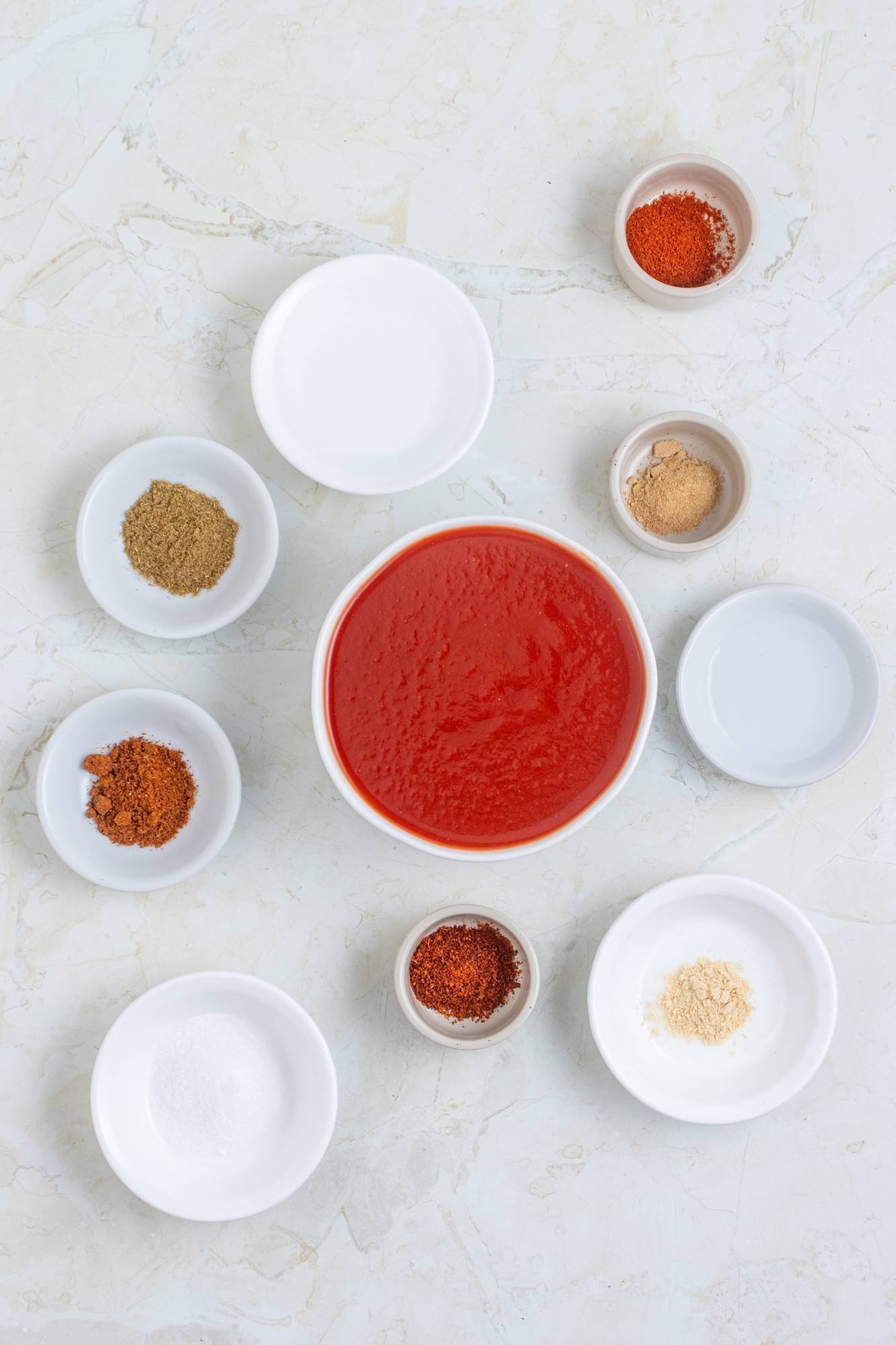 Taco sauce ingredients include ketchup, vinegar, sugar, chili powder, garlic powder, onion powder, paprika, cumin, and cayenne pepper.