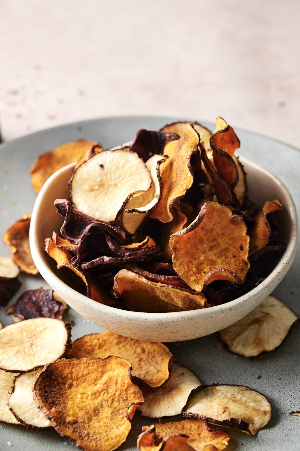 Close-up of golden brown microwave vegetable slices showing crisp texture and natural plant colors.