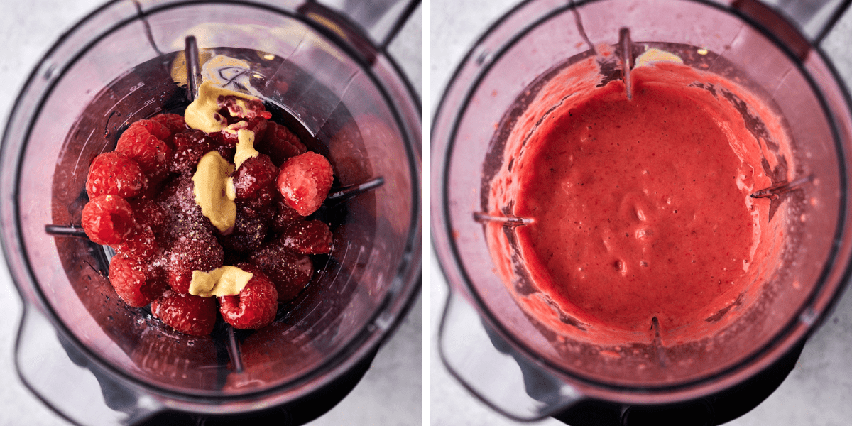 A blender filled with fresh raspberries and a ball of mustard transitions from the whole ingredients to a smooth, vibrant pink mixture.