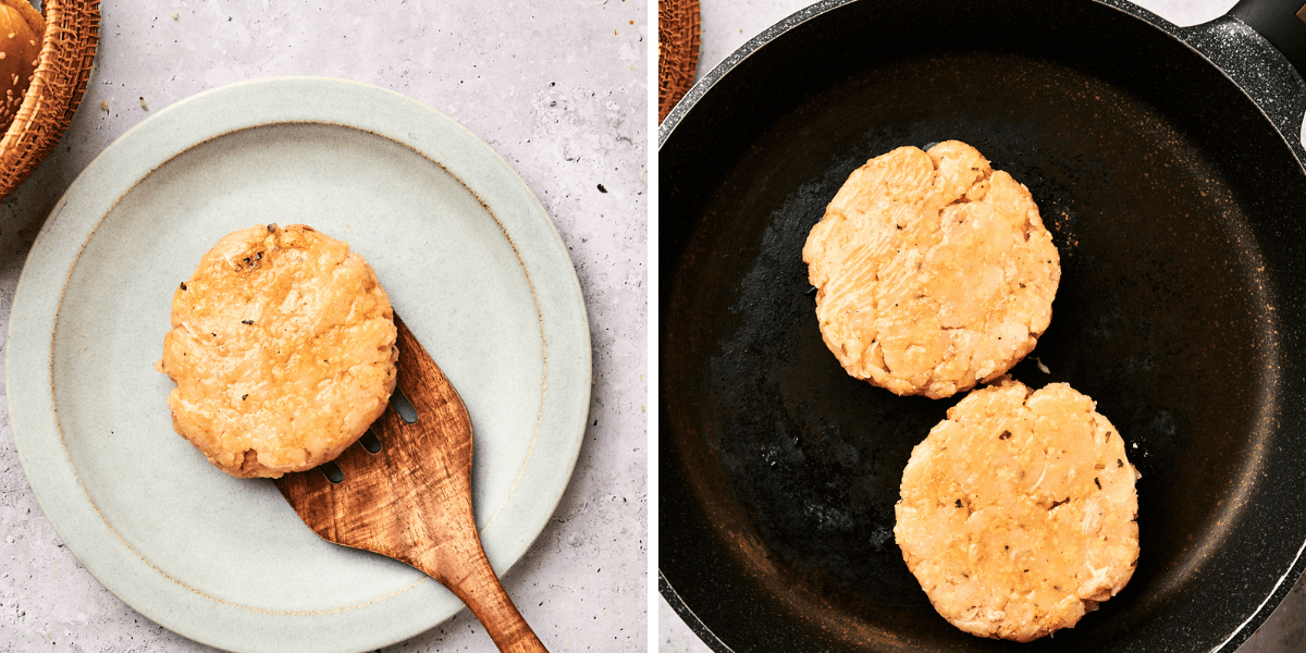 A formed tilapia fish burger patty is placed on a plate, while two patties are cooking in a black skillet.