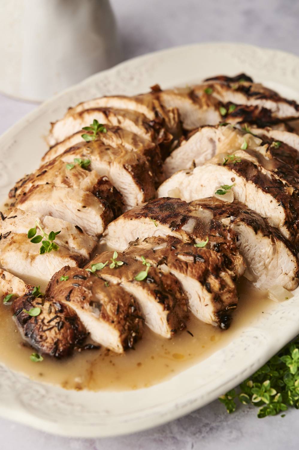 Sliced turkey breast tenderloin sitting on a plate.