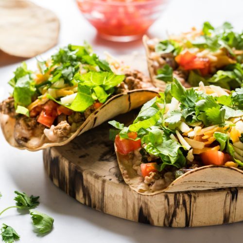 Turkey poblano tostadas with ground turkey, poblano peppers, and onions served on baked corn tortillas.