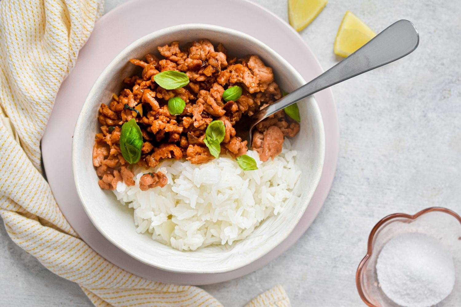 10 Ground Turkey Recipes You'll Actually Crave Thai basil ground turkey in a bowl with white rice and Thai basil leaves.