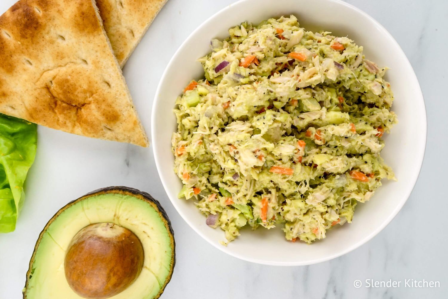 Avocado Tuna Salad Avocado tuna salad with red onion, celery, and carrots.