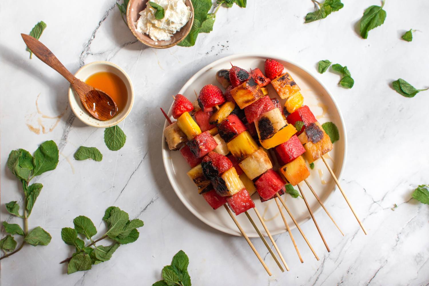 Grilled Fruit Recipes Grilled fruit skewers with watermelon, strawberry, pineapple, and mint.