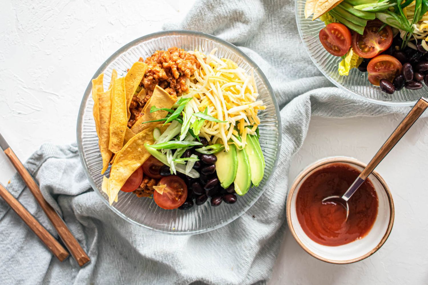 Turkey Taco Salad Turkey taco salad with ground turkey, tomatoes, black beans, cheddar cheese, and crispy tortilla strips.