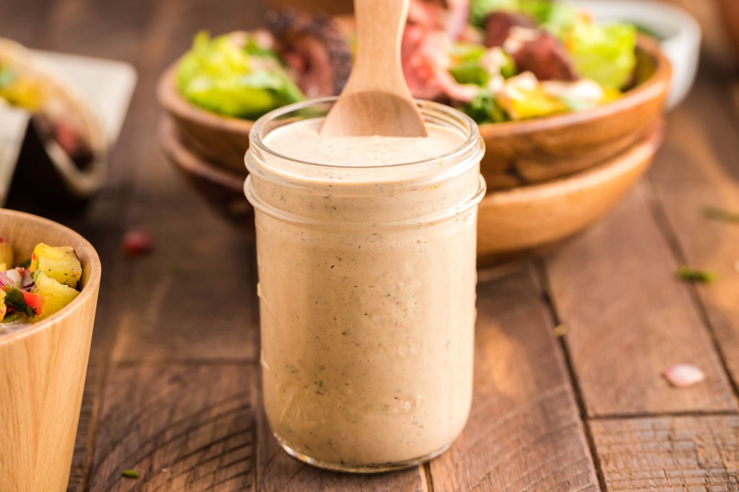 Southwest Salad Dressing Southwest salad dressing in a glass jar with Greek yogurt, lime juice, taco seasoning, and salsa.