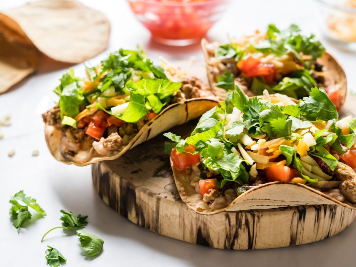 Turkey poblano tostadas with ground turkey, poblano peppers, and onions served on baked corn tortillas.